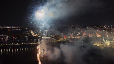 Holiday fireworks above water with reflection on the black sky background Stock Footage 346706102