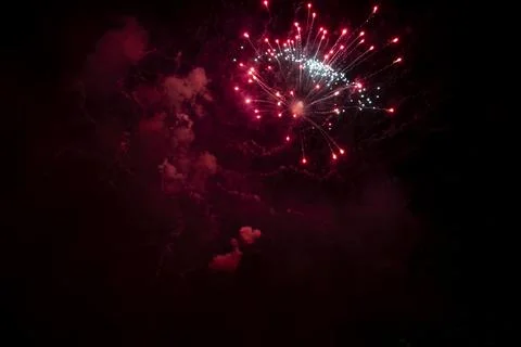 Holiday fireworks in July Stock Photos