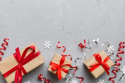 Holiday flat lay with gift boxes wrapped in colorful paper and tied decorated Stock Photos