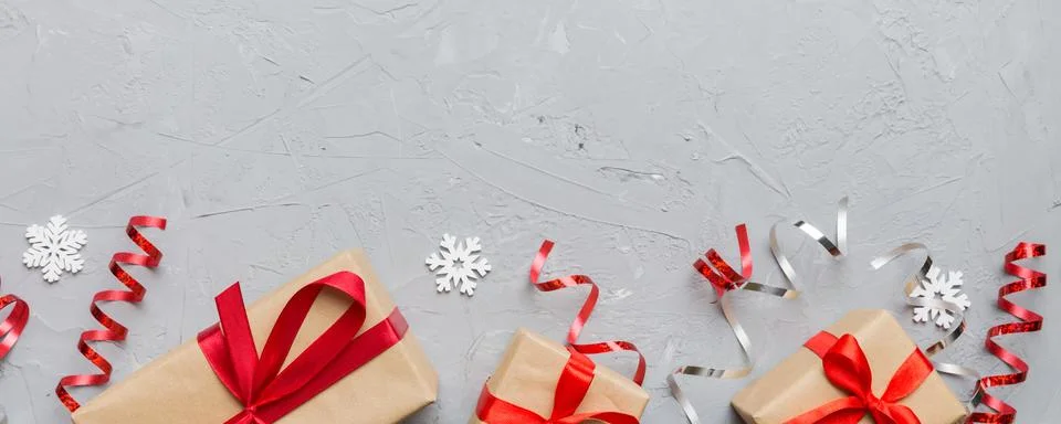 Holiday flat lay with gift boxes wrapped in colorful paper and tied decorated Stock Photos