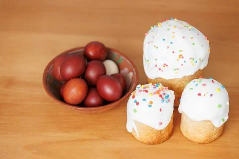 Holiday food background with Easter cake and painted eggs Stock Photos
