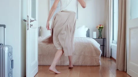 Holiday, fun and legs on bed with jump, travel optimism and happiness on summer Stock Footage 335397294