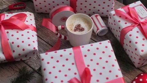 Holiday Gift Boxes and Coffee on a Wooden Table Stock Footage 71508013