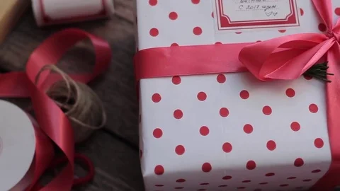 Holiday Gift Boxes on a Wooden Table 스톡 동영상 71509008
