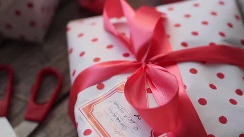 Holiday Gift Boxes on a Wooden Table Stock Footage 71509256