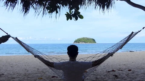 Holiday hammocks at the beach in a hammock on a summer holiday Stock-Footage 109155016