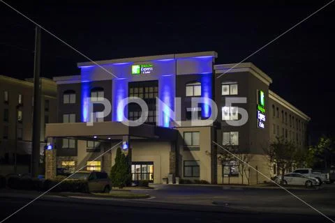 Holiday Inn Express building distant view at night close up
