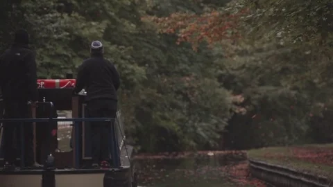 Holiday makers sailing down the Llangollen Canal during the Autumn with leaves Video stock 71829147