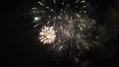 Holiday multicolored firework in dark sky and bright moon Stock Footage 96453141