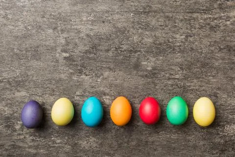 Holiday preparation Multi colors Easter eggs on colored background . Pastel c Stock Photos