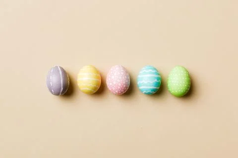 Holiday preparation Multi colors Easter eggs on colored background . Pastel c Stock Photos