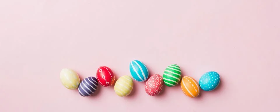 Holiday preparation Multi colors Easter eggs on colored background . Pastel.. Stock Photos