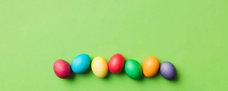 Holiday preparation Multi colors Easter eggs on colored background . Pastel.. Stock Photos