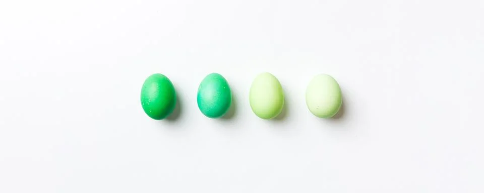Holiday preparation Multi colors Easter eggs on colored background . Pastel c Stock Photos