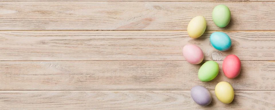 Holiday preparation Multi colors Easter eggs on colored background . Pastel.. Stock Photos