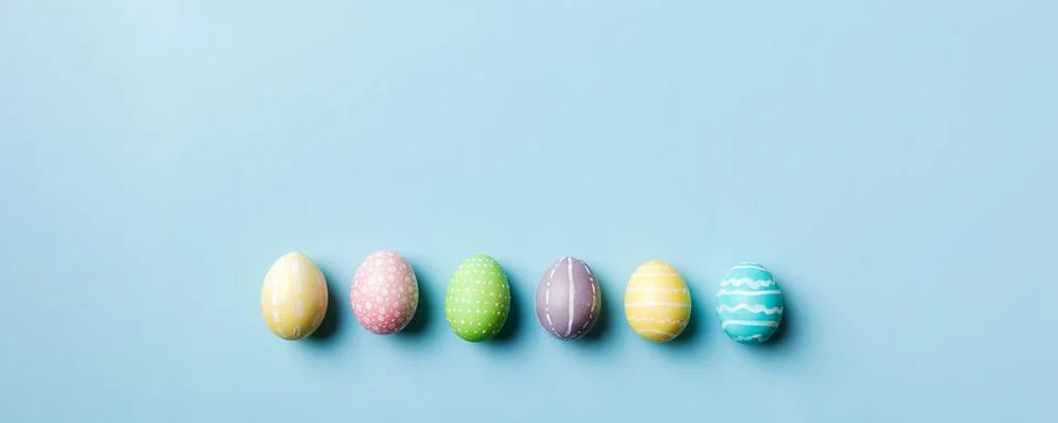 Holiday preparation Multi colors Easter eggs on colored background . Pastel.. Stock Photos