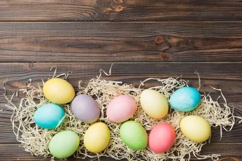 Holiday preparation Multi colors Easter eggs on colored background . Pastel.. Stock Photos