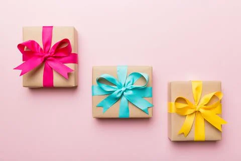 Holiday present box over colored background, top view Stock Photos