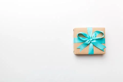 Holiday present box over colored background, top view. Copy space for design Stock Photos