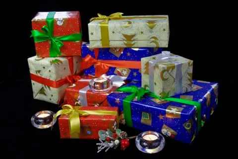 Holiday present gift boxes isolated on black background. Stock Photos