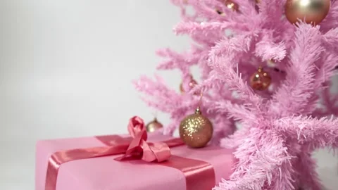 Holiday still life with stack of presents under artificial Christmas pine filmed Video stock 230919608