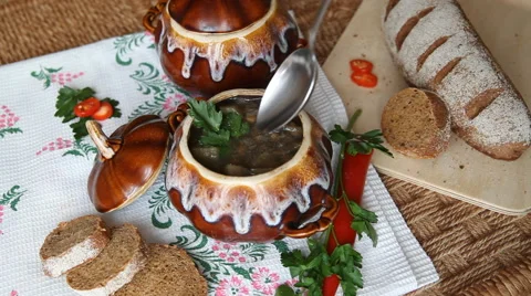 On holiday table pot with meatless soup. Dip spoon and scoop up full spoon soup. Stock Footage 61919034