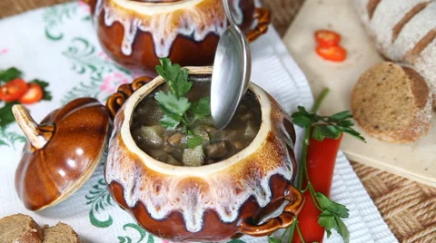 On holiday table pot with meatless soup. Scoop up full spoon soup. Slow video. Stock Footage 62057951