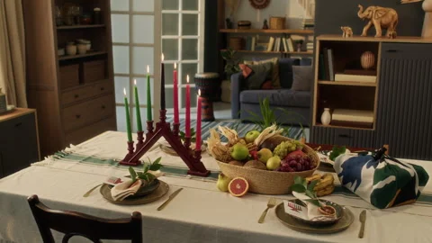 Holiday Table Set for Four with Kinara and Fruit Basket Prepared for Kwanzaa Stock Footage 319896283
