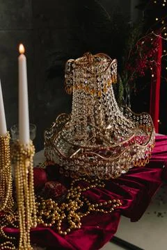 Holiday table setup with sparkling crystal decorations and candles. Stock Photos
