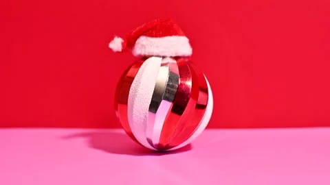 Holiday Whimsy: Ornament Decked Out in a Charming Santa Hat Stock Footage 255339844