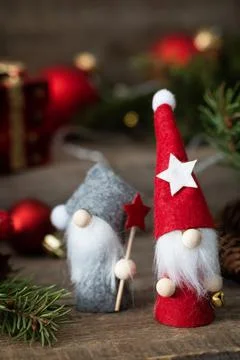 Holiday Xmas concept. Christmas card with gnomes, fir tree, christmas lights  Stock Photos