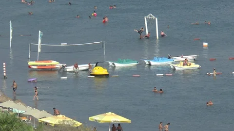 Holidaymakers Having Fun In The Sea Stock Footage 95325946