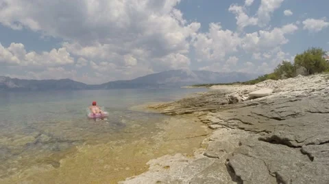Holidays by the sea in the background mountains Stockbeeldmateriaal 60993934
