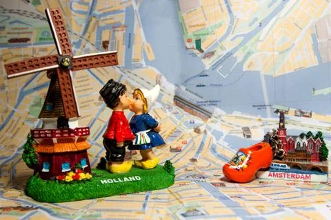 Holland souvenir with Amsterdam maps in background. Stock Photos