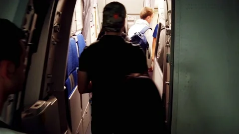 Holliday makers boarding on plane from connection bridge, pov entrance into plan Stock Footage 236804516