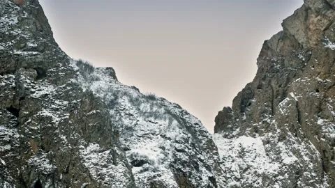 A hollow between two rocks. Stone cleft, covered with snow. Lake Baikal, Siberia Stock Footage 228883390