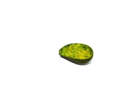 Hollowed Avocado Shell on a White Background, Remnants of Creamy Goodness Stock Photos