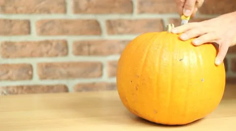 Hollowing a pumpkin HD Stock Footage 8998080