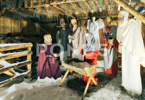 Holly Scene From The Barn Where Jesus Was Born Wax Characters In The Spot Lights Stock Photos