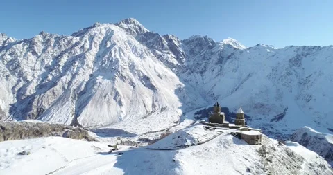 Holly Trinity church in stephantsminda, Gergeti in Republic of Georgia. Kazbegi  Stock Footage 146597175