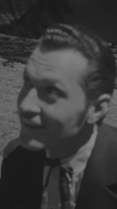 HOLLYWOOD - 1936 - Close-ups of character actors between takes on a period Stock Footage 340323372