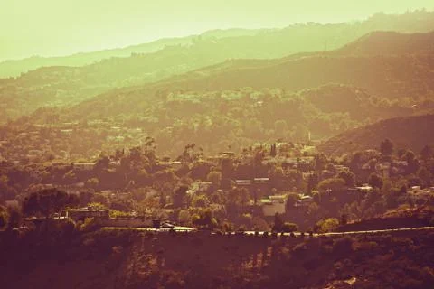 Hollywood hills panorama - hazy los angeles area in hot summer day. sepia col Stock Photos