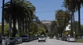 Hollywood Sign Los Angeles Entertainment World Symbol Cars Passing Palm Trees HD Footage