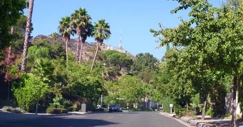 Hollywood sign view from Driving in the neighborhood of Hollywood Hills Stock Footage 85077614