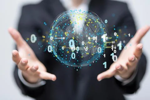 Hologram of binary codes around a globe between the palms of a businessman Stock Photos