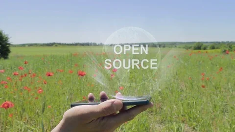 Hologram of Open source on a smartphone Vídeos de archivo 107362156