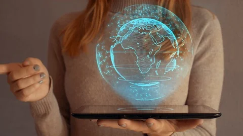 Hologram screen on a tablet with digital data globe and world map Видео 105032721