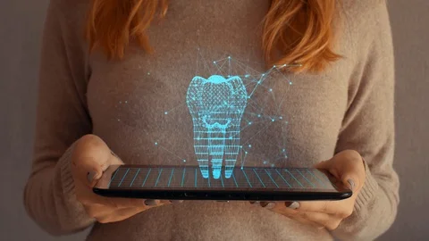 Hologram screen on a tablet with digital datas, tooth and particles 스톡 동영상 104826987
