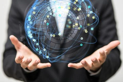 A hologram of a sphere made of interconnected dots on a businessman's palms - Stock Photos