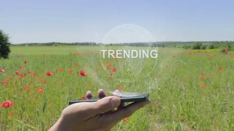 Hologram of Trending on a smartphone Stock Footage 107912937